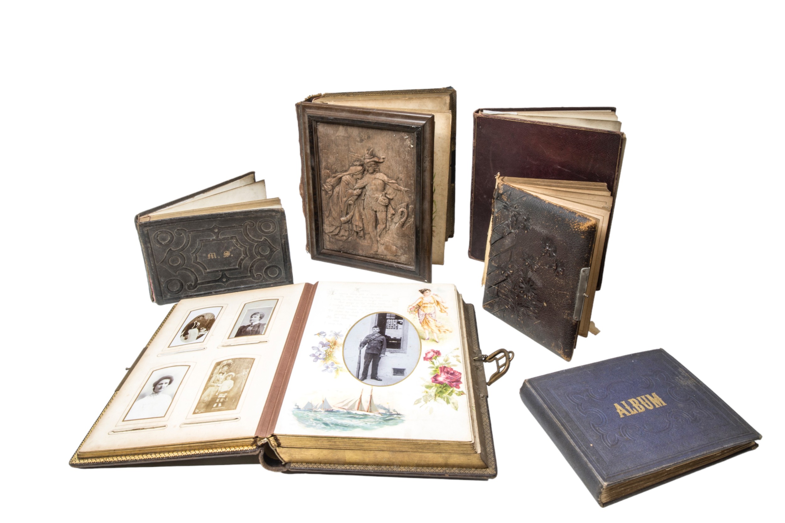A VICTORIAN LEATHER BOUND MUSICAL PHOTOGRAPH ALBUM , another with a wooden cover and various other