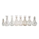 A MIXED GROUP OF SEVEN VINTAGE GLASS DECANTERS AND SAUCE BOTTLE, various sizes, all faceted and with