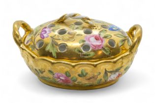 AN EARLY 19TH CENTURY VIOLET POT Circa 1820, scattered flowers on a gold ground, 10cms wide