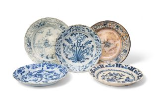 THREE DELFT CHARGERS 18th Century, and a faience charger, 36cms wide