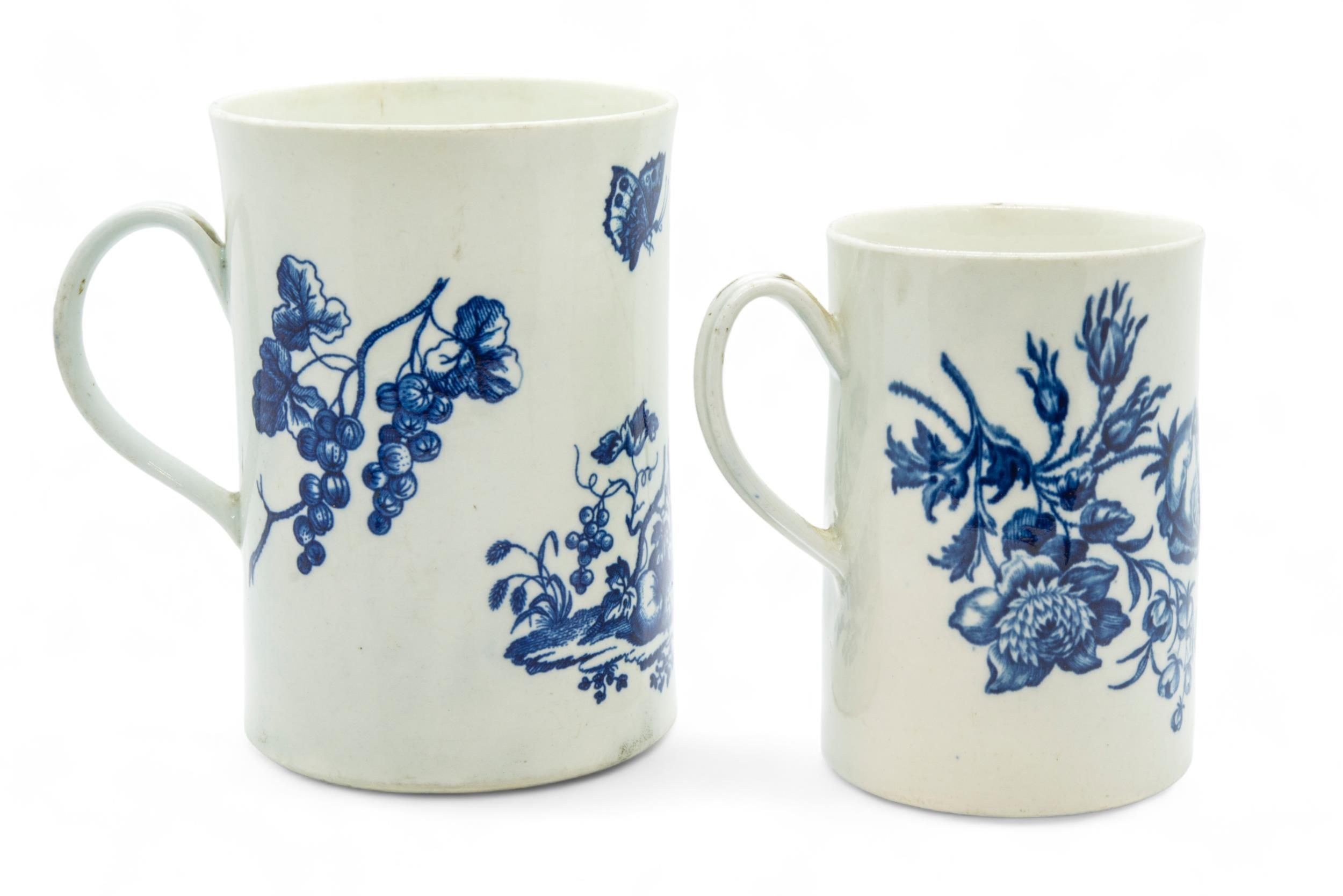 TWO 18TH CENTURY WORCESTER BLUE PRINTED TANKARDS One printed with a parrot and fruit and with