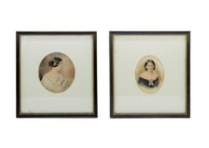 A PAIR OF 19TH CENTURY PORTRAIT WATERCOLOURS, depicting young ladies in elegant gowns, in oval