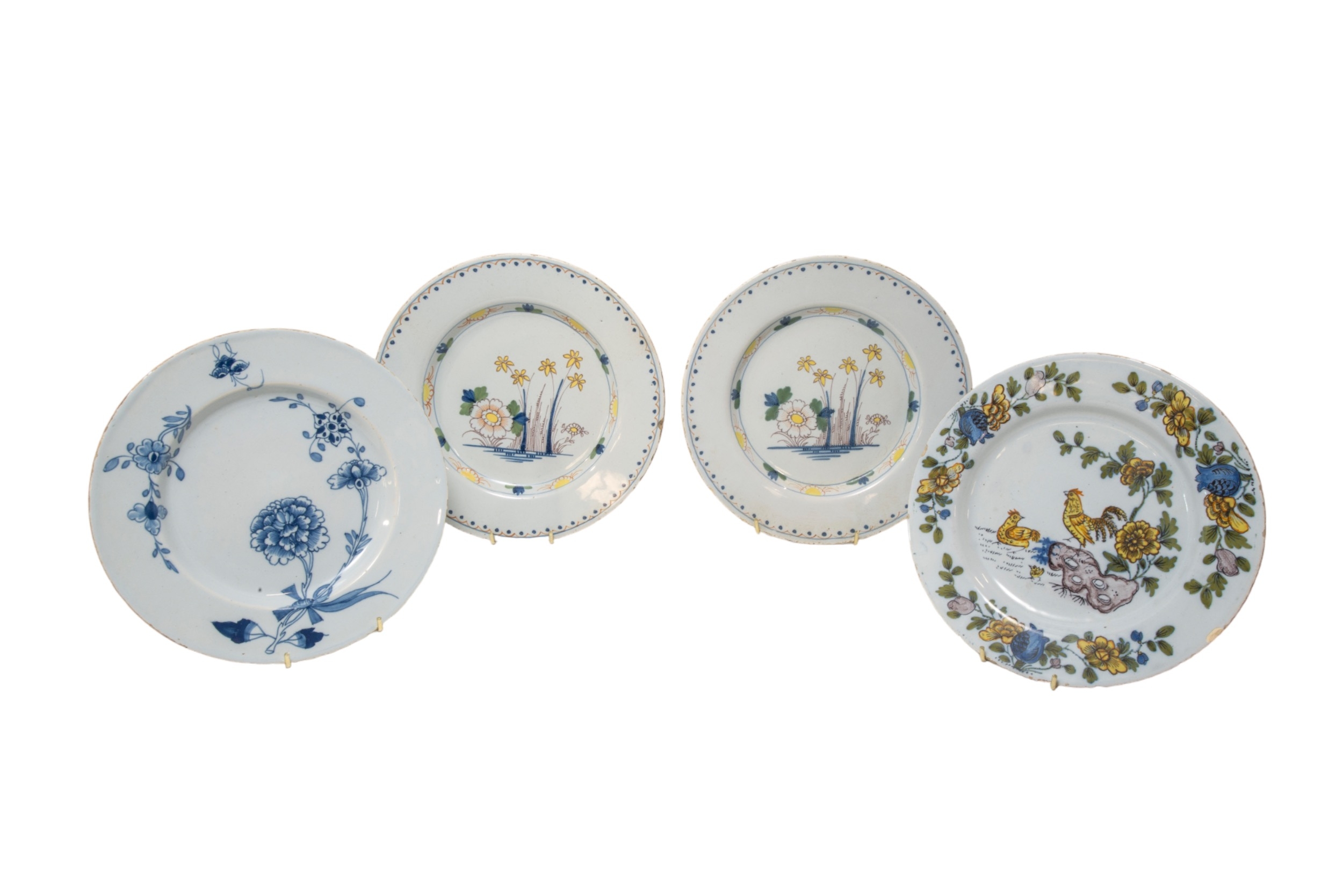 A LIVERPOOL DELFT PLATE Circa 1760, painted in Fazakerley palette and three other Delft plates