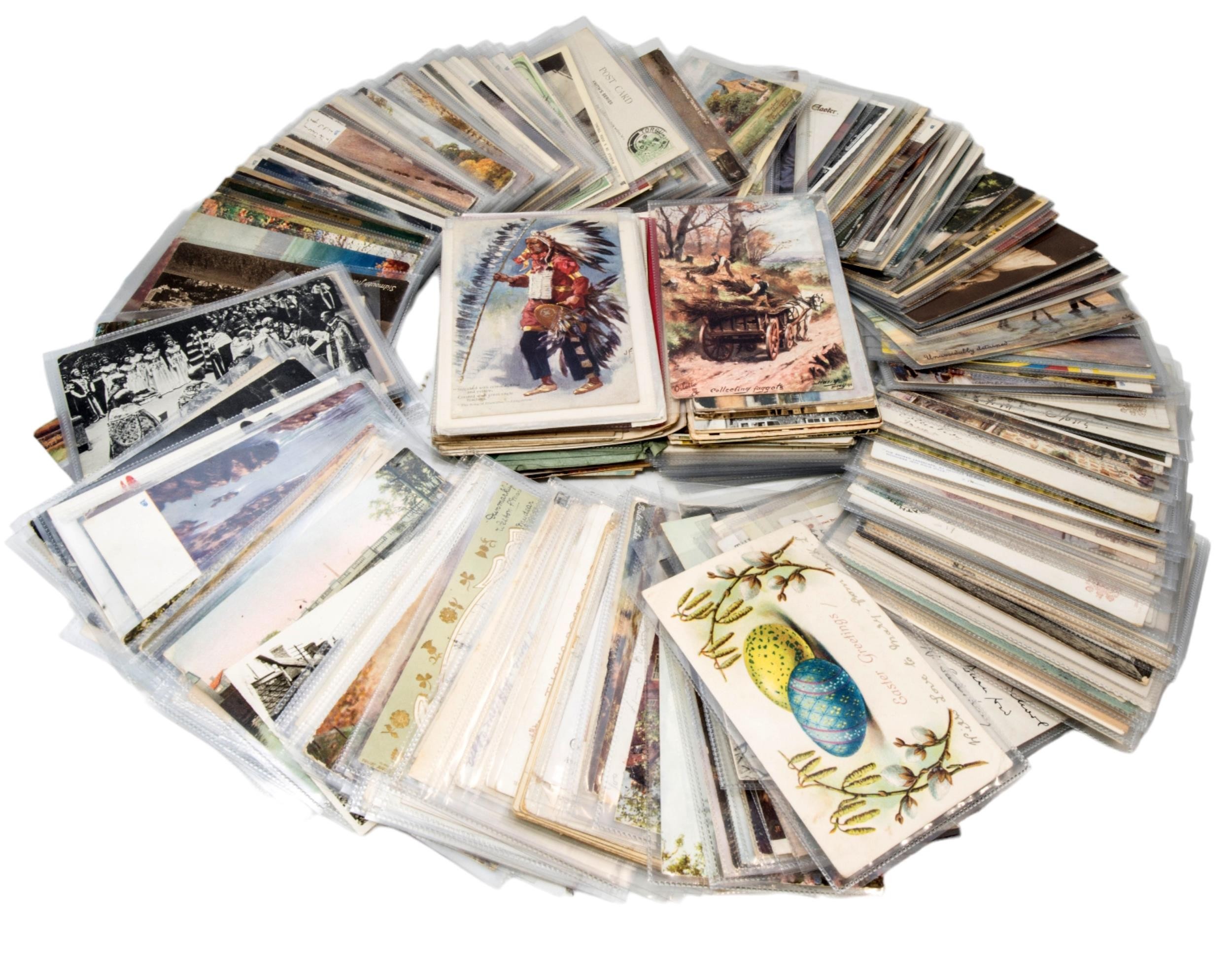 A COLLECTION OF LOOSE POSTCARDS in plastic wallets including Tuck’s Greetings Cards. A lot.