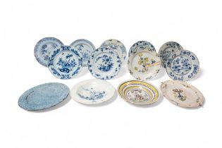 THIRTEEN DELFT PLATES 18th century and a speckled tin glazed plate, 22cms wide