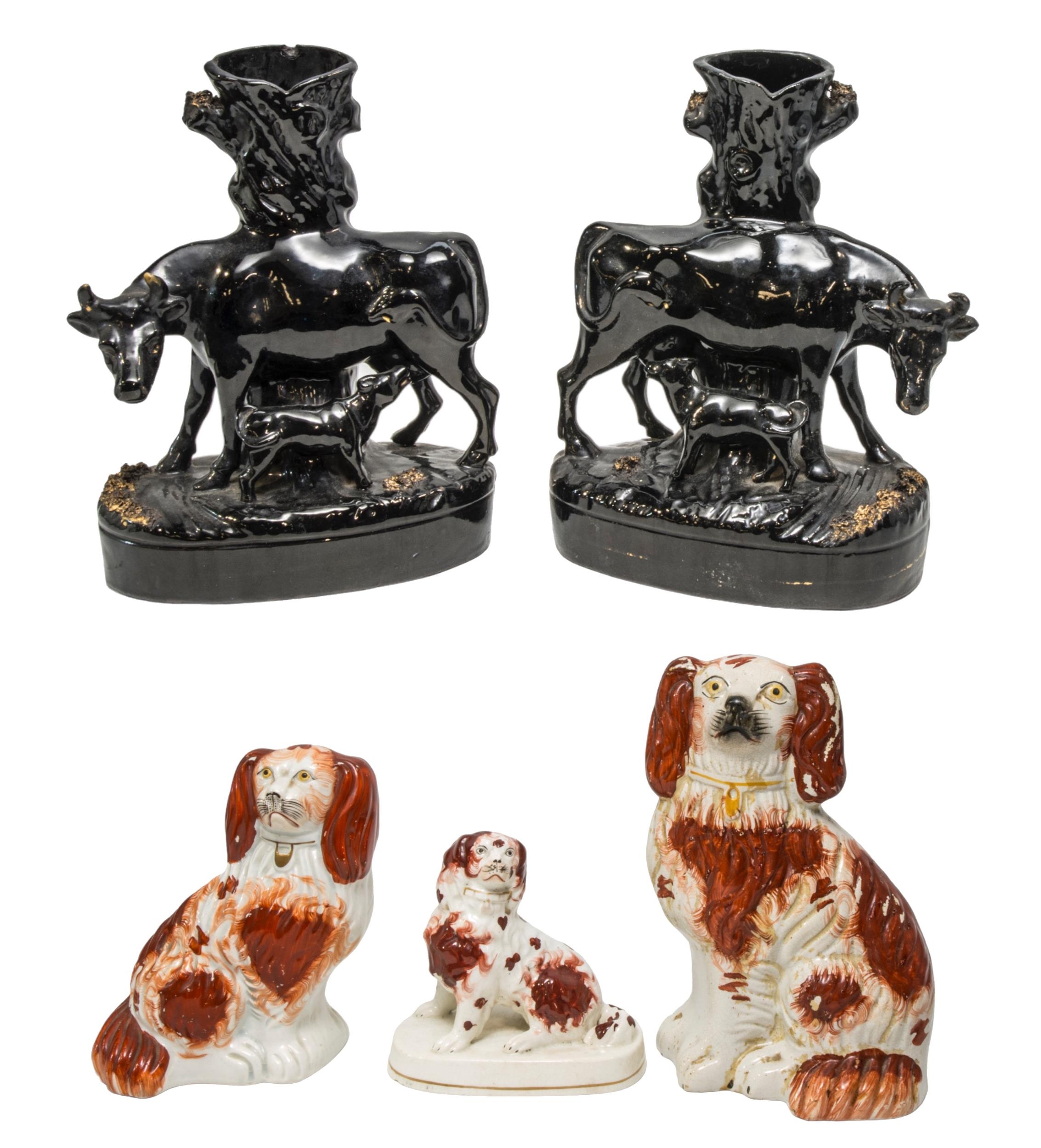 A PAIR OF STAFFORDSHIRE CATTLE DECORATED SPILL VASES AND THREE SPANIEL FIGURES, 19TH CENTURY, the