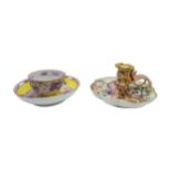 A MEISSEN CHAMBERSTICK AND MEISSEN CUP AND SAUCER, 18TH/19TH CENTURY, the lobed chamberstick painted