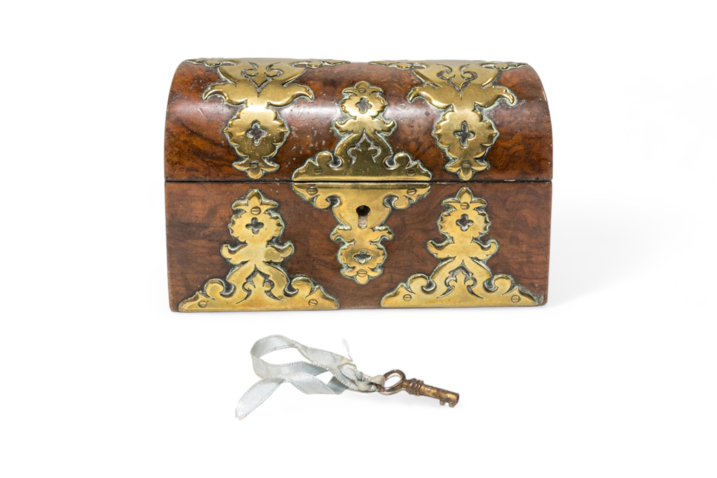 A 19TH CENTURY DOMED TOP WALNUT SCENT BOTTLE BOX, decorated with pierced brass mounts and containing