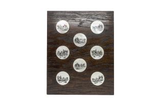 EIGHT MOTHER OF PEARL BUTTONS 19th / 20th century, mounted on oak board, 5cms