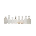 A MIXED GROUP OF EIGHT 19TH CENTURY CUT GLASS DECANTERS, the lot includes three square form