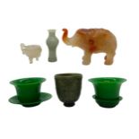 FOUR PIECES OF PEKING GLASS AND A CARVED HARDSTONE ELEPHANT, along with a carved hardstone cup, a