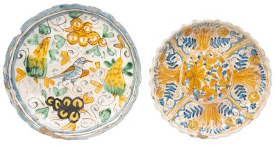 TWO ITALIAN FAIENCE DISHES, EARLY 18TH CENTURY, one of lobed form and painted with bird and fruit