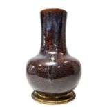 A CHINESE FLAMBE BOTTLE VASE, LATE QING, 19TH CENTURY, globular body rising to a wide cylindrical