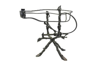 A 19TH CENTURY FRENCH WINE DECANTING CRADLE, with crank operated mechanism, on a vine decorated