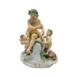 A CONTINENTAL PORCELAIN GROUP FIGURE OF BEARDED FIGURE AND TWO PUTTI, probably late 18th century,