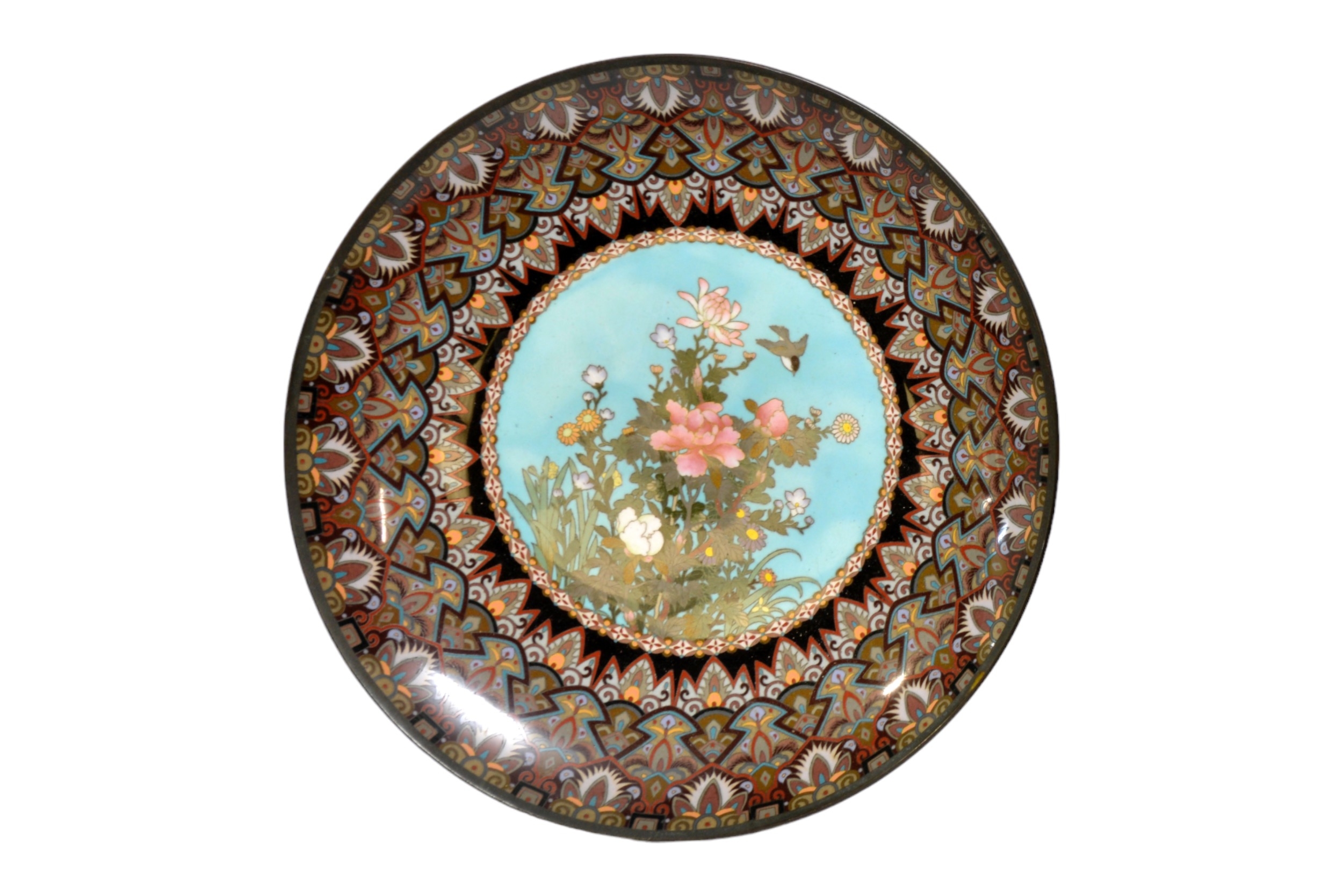 A JAPANESE CLOISONNE CHARGER decorated with a bird flying above flowers, the border with a layered