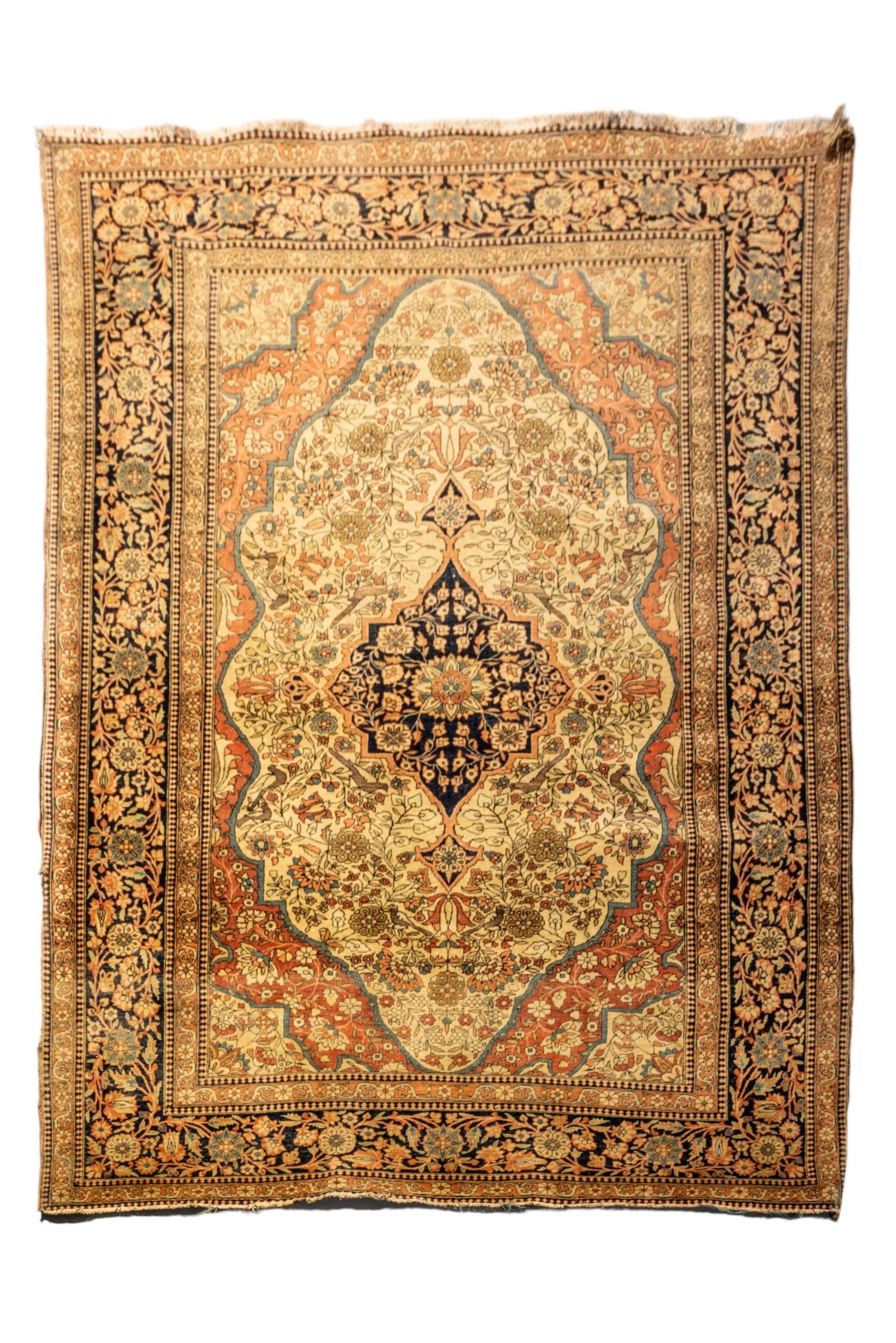 A HAND KNOTTED PERSIAN WOOL RUG, LATE 19TH / EARLY 20TH CENTURY, probably Kashan, slightly faded and