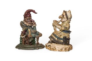 IRON PUNCH AND JUDY DOORSTOPS (Not a pair) with degraded paint finish. 31 cms max