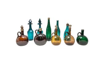 A GROUP OF FIVE EARLY 19TH CENTURY SPIRIT DECANTERS, A PAIR OF EMERALD GREEN GLASS DECANTERS AND