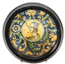 AN ITALIAN FAIENCE DISH, 17TH CENTURY, the central circular reserve painted with a portrait of a