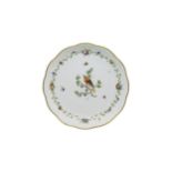 AN OUDE LOOSDRECHT DISH Circa 1780, painted with a bird on a branch, 22cms