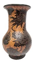 A VINTAGE DONA SAIGON EARTHENWARE VASE, CIRCA 1960, the sides decorated with coiled scaly dragons on