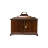 A GEORGE III STYLE MAHOGANY TABLE-TOP 'CABINET', the shaped top with brass swing handle and two