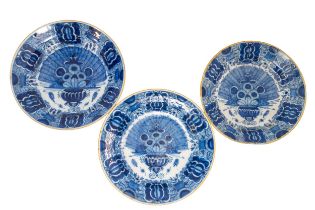 THREE DUTCH DELFT 'PEACOCK' DISHES, 18TH CENTURY, decorated with an arrangement of flowers and