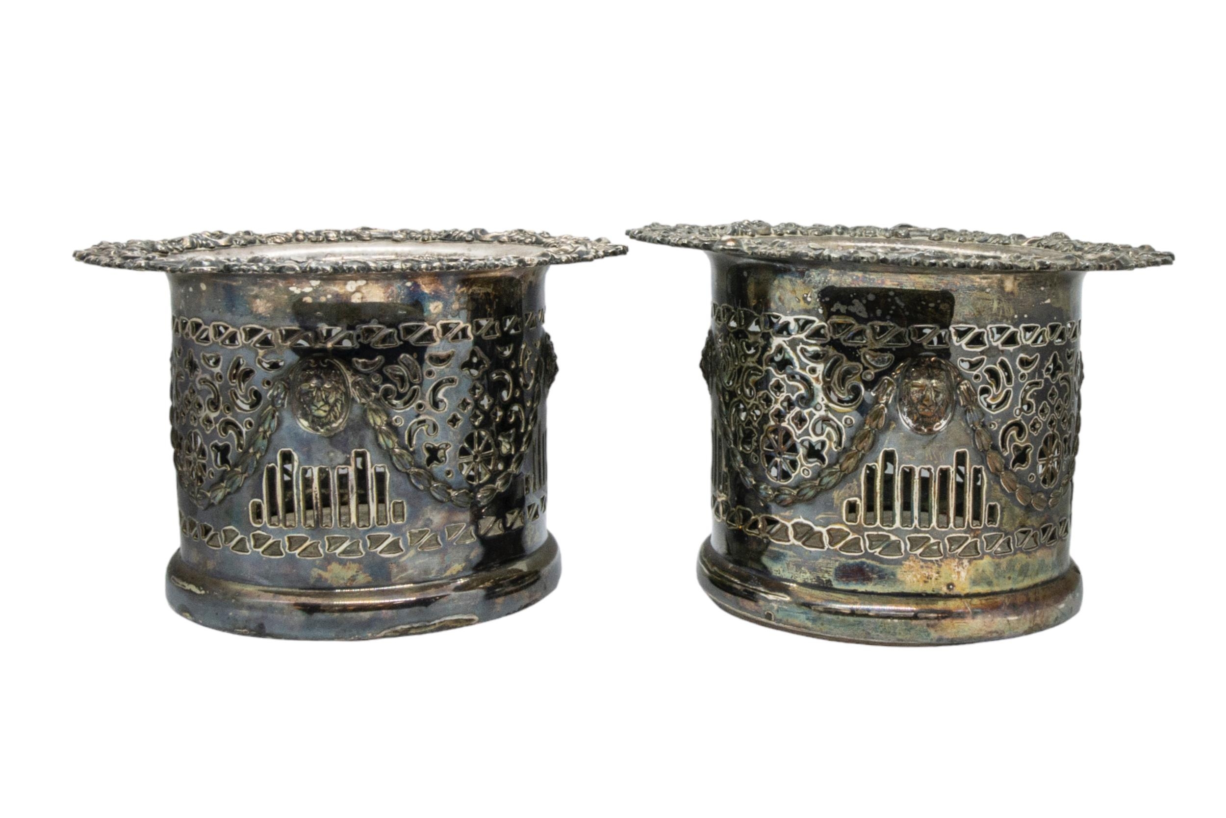 A PAIR OF VINTAGE WHITE METAL WINE BOTTLE HOLDERS, the handle and collar modelled as fruiting vines, - Image 3 of 3