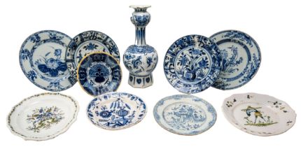 A MIXED GROUP OF NINE DELFT DISHES AND A BOTTLE VASE, 18TH CENTURY AND LATER, the dishes include two