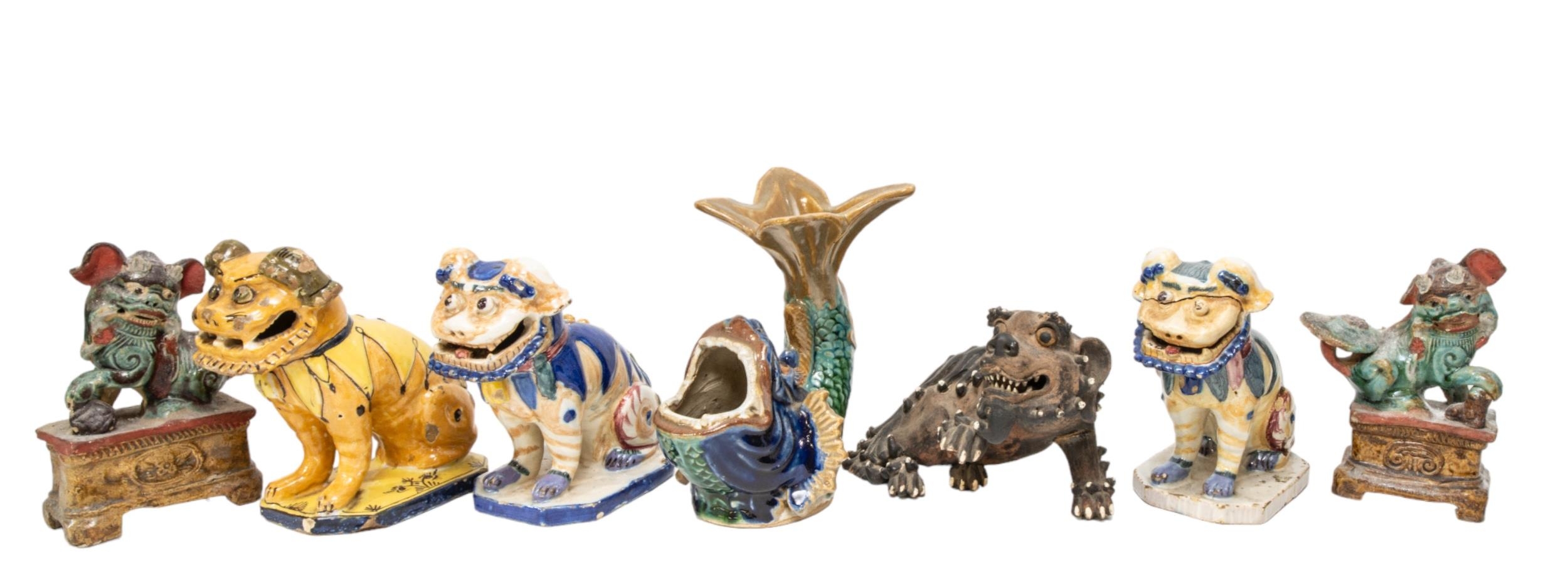 A MIXED GROUP OF CHINESE POTTERY FOO DOG MODELS AND A FISH MODEL, the lot includes a pair of dogs