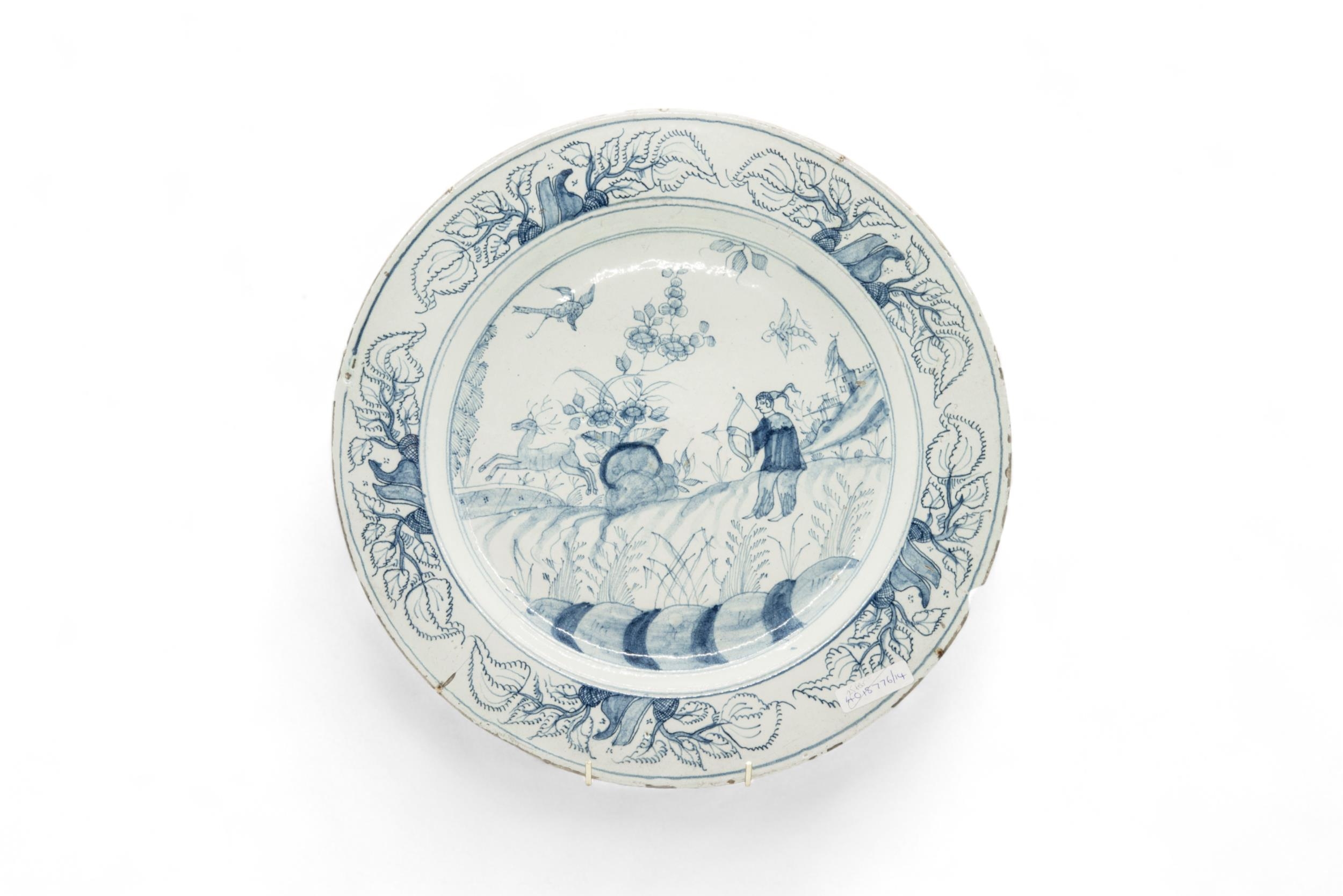 THREE DELFT CHARGERS 18th Century, and a faience charger, 36cms wide - Image 5 of 7