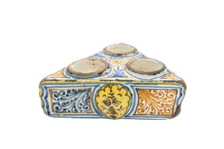 A MEDITERRANEAN POLYCHROME FAIENCE TRIPLE INKWELL, 17TH CENTURY, probably Spanish or Southern