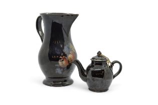 A LARGE JACKFIELD WARE SPARROW BEAK JUG AND A TEAPOT Mid 18th century, the jug with traces of cold