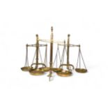 AN AVERY BRASS BEAM BALANCE AND TWO OTHER BRASS BEAM BALANCES 56 cms max