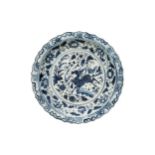 A LARGE CHINESE BLUE AND WHITE DISH, LATE QING 19TH CENTURY, the barbed rim dish painted with a