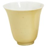 A FINE LEMON-YELLOW GLAZED WINE CUP QING DYNASTY, 18TH CENTURY 清十八/十九世纪 黄釉铃铛杯 of tall beaker form,
