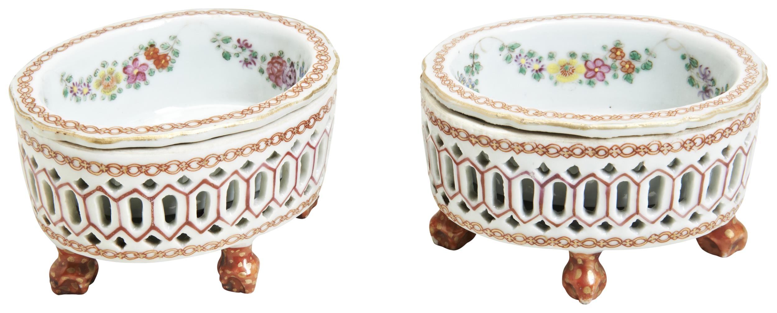 A PAIR OF FAMILLE ROSE EXPORT OVAL RETICULATED SALTS QIANLONG PERIOD (1736-1795) each raised on four