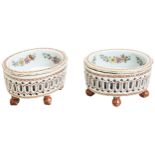 A PAIR OF FAMILLE ROSE EXPORT OVAL RETICULATED SALTS QIANLONG PERIOD (1736-1795) each raised on four