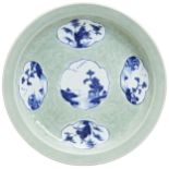 AN UNDER-GLAZED BLUE CELADON-GROUND 'LANDSCAPES' DISH QING DYNASTY, 19TH CENTURY the circular dish
