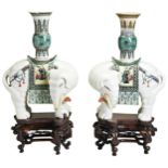 A PAIR OF FAMILLE VERTE AND WHITE-GLAZED ELEPHANT INCENSE BURNERS  LATE QING DYNASTY 清 太平有象摆件一对