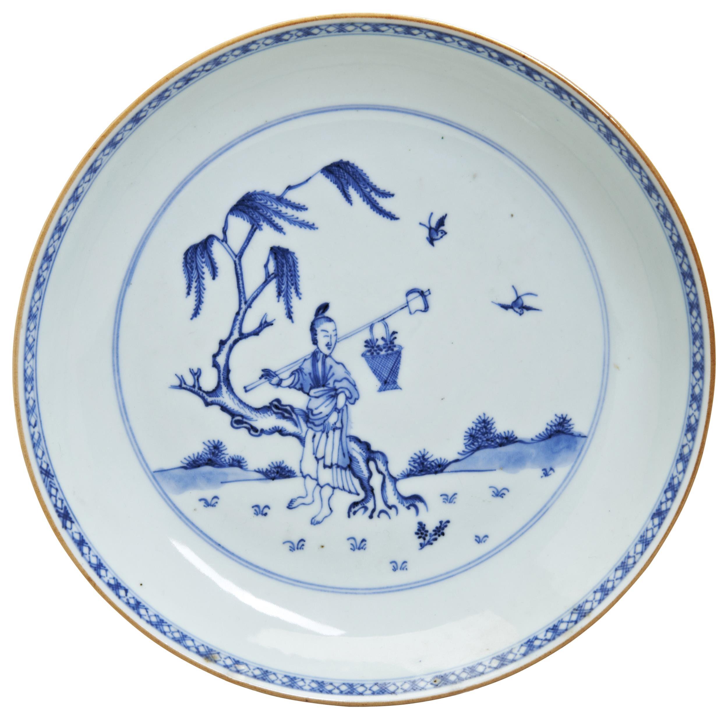 A BLUE AND WHITE DISH QING DYNASTY, 18TH CENTURY fienly painted with a figure seated beneath a