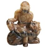A BROWN JADE FIGURE OF BODHISATTVA SEATED ON LION 19TH/20TH CENTURY  brown jade carved in a figure
