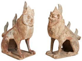 A VERY RARE PAIR OF CHINESE POTTERY EARTHENWARE HAND SCULPTED FIGURES OF MYTHICAL TOMB GUARDIANS