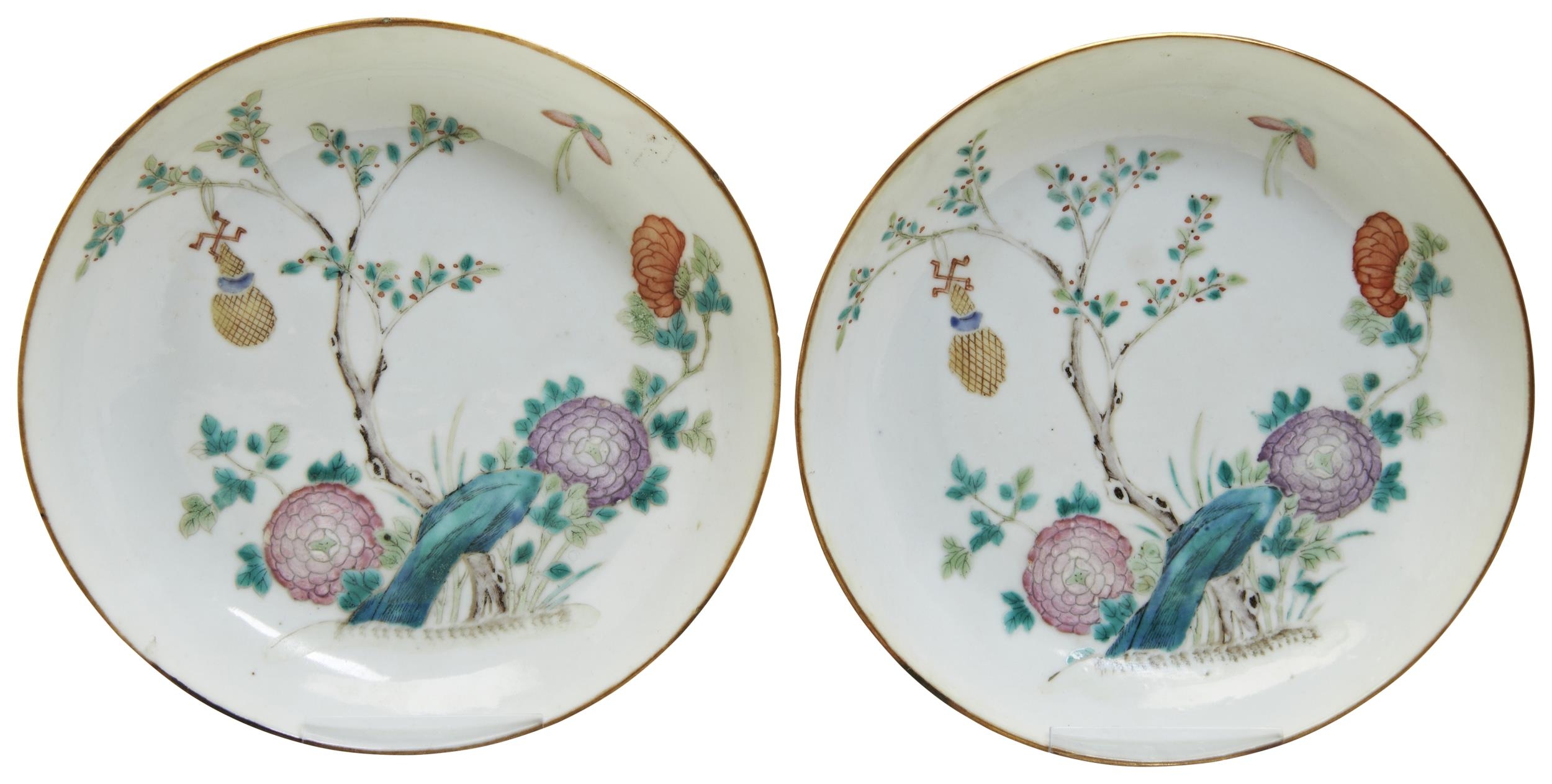 A PAIR OF FAMILLE ROSE DISHES TONGZHI SEAL MARKS IN IRON-RED AND OF THE PERIOD painted with brightly
