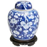 A BLUE AND WHITE 'CRACKED-ICE' JAR AND COVER LATE QING DYNASTY in the Kangxi-style, bears an