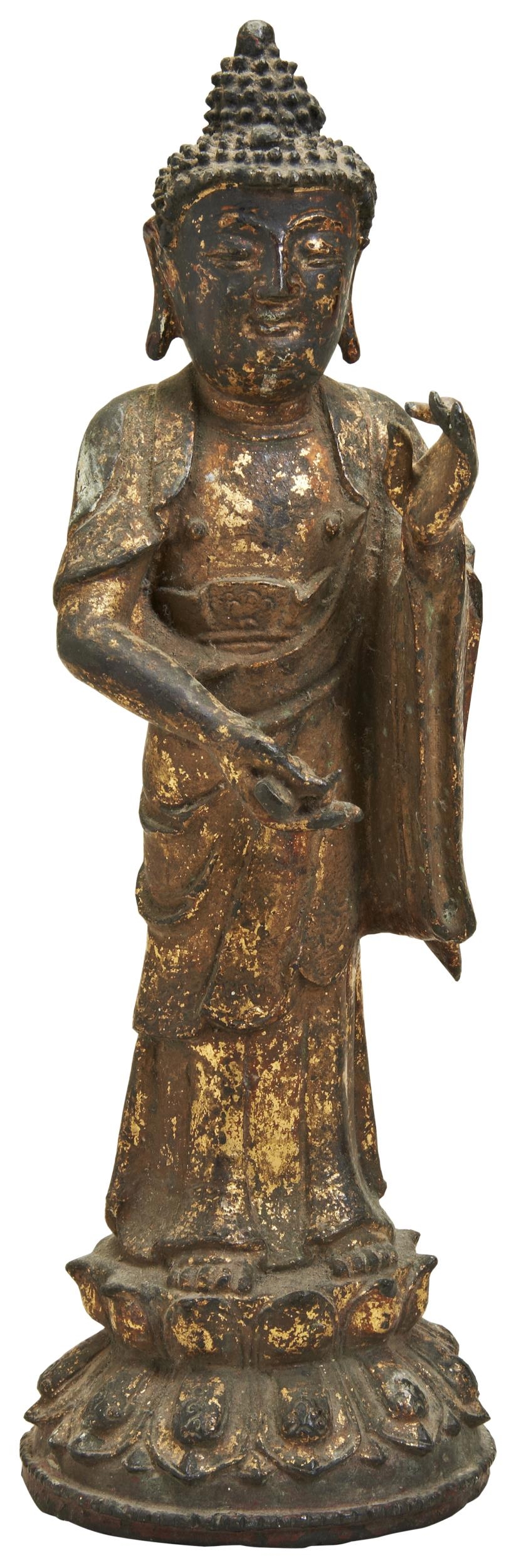 A GILT LACQUERED BRONZE STANDING BUDDHA MING DYNASTY (1368-1644)  cast wearing long robes,