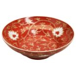A SMALL CORAL-RED 'LOTUS' DISH LATE QING DYNASTY decorated with lotus blossoms and scrolling