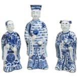 THREE BLUE AND WHITE FIGURES OF IMMORTALS  LATE QING DYNASTY the standing figures in long flowing