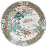 A FAMILLE VERTE CHARGER  QING DYNASTY, 19TH CENTURY decorated with a figural mountain landscape